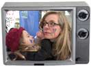 Child face painting mom, in tv frame