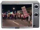 Take Back the Night march in TV frame