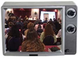 TV frame with image of conference session inside