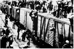 strikers boarding boxcars for the trek