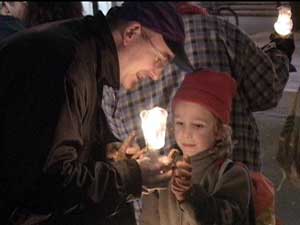 Protest and son at vigil outside Armerican Consulate