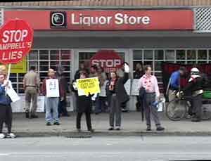 Protestors outside closing liquor store