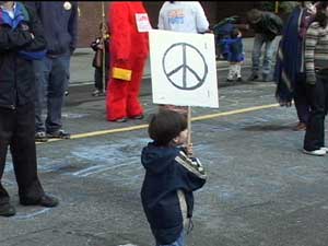 Young peace activist carrying sign