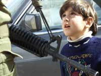 Palestinian boy at Israeli checkpoint