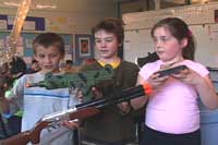 Students with soon to be transformed war toys
